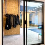 FP products , Sound-isolating glass sliding door opened in an office space