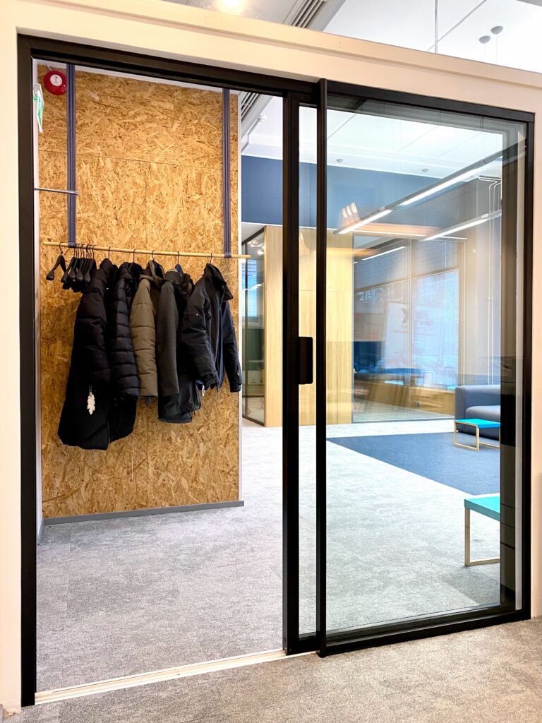 FP products , Sound-isolating glass sliding door opened in an office space