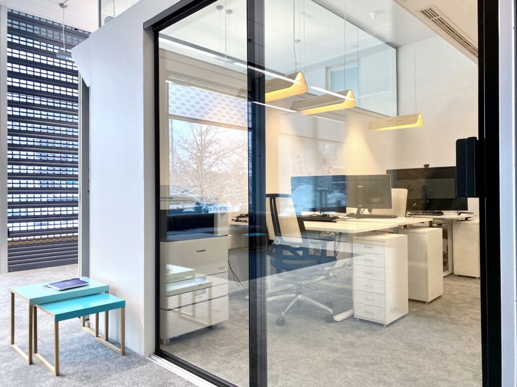 Sound-isolating glass sliding door at office