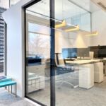 Sound-isolating glass sliding door at office